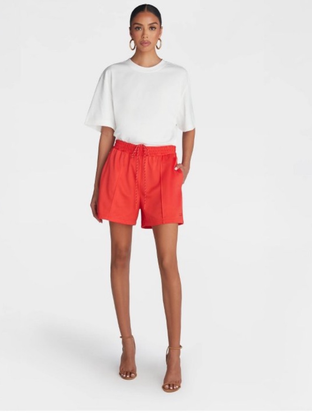 KBB by Kahlana. Red mid-rise track shorts with white strip. Size Medium NWT